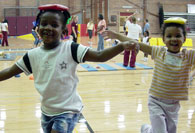 Students balancing beanbags on their heads