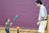 Student batting ball off tee