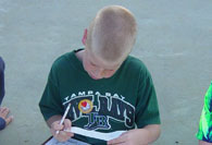 Boy reading study sheet