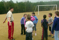 Intern giving instructions on field