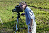 Girl videotaping students