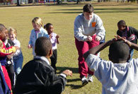Student intern teaching in a circle of students