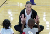 Student intern clapping with student
