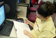 Student intern working at a computer