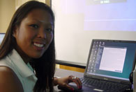 Student presenting with laptop computer