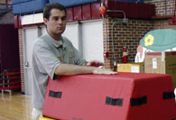 Student intern setting up mats