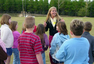 Student intern giving instructions to students