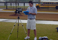 Student intern writing and videotaping