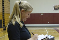 Intern writing on clipboard