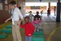 Boy being lead to mat