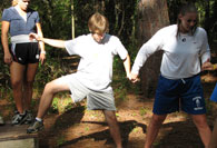 Students going across obstacle