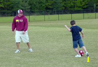 Student dribbling a soccer ball