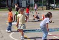 Students jumping through hoops