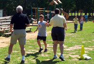Student running around field