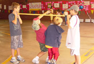 Students going under limbo stick