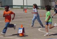 Students running to cone