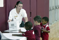 Students writing at table